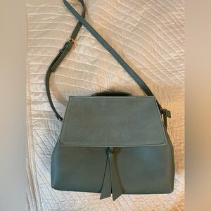 Vici Moda Luxe green shoulder or crossbody bag. Slight chip in color on knot.